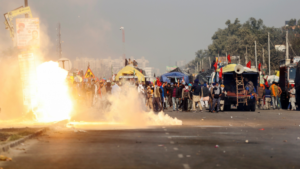Delhi police fire tear gas shells on the farmers protesting at Singhu border